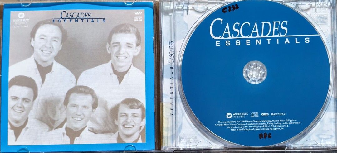 The Cascades Essentials CD Album (Category: CDs & DVDs) located in Manila. Submitted by ruelcabrer77078 (Listing ID 1470093159, Image 2). Description: - Artist & Album: The Cascades - Essentials - Release: Warner Music Philippines, 2005 - Tracks: 12 classic hits including Shy Girl, Rhythm of the Rain, Dreamin', and The Last Leaf - Format: Standard jewel case - Inclusions: Original disc and inserts with tracklist on the back cover - Condition: Goo