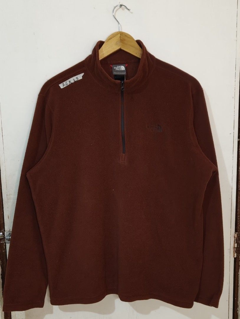 The North Face 1/4 Zip Fleece Pullover Brown (Category: Coats, Jackets and Outerwear) located in Bulacan. Submitted by adrian2325 (Listing ID 1470111744, Image 1). Description: - Brand: The North Face - Style: Quarter-zip fleece with high collar and zipper pull - Color: Deep brown - Material: Warm and soft Polartec fleece - Size: Tagged meduim (Approx. 26 x 23 inches) - Details: Embroidered logo on the chest - Condition: Great layering piece for 