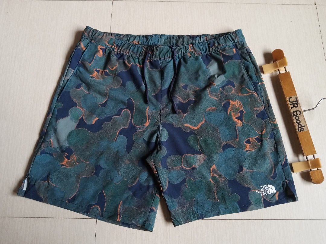 The North Face athletic Camo Shorts (Category: Shorts) located in Tanay. Submitted by jrgoods (Listing ID 1469959494, Image 2). Description: TNF athletics aop short Large men's above the knee Waistline 34-36 Length 17.5 Good as new condition 880+ship Tanay Rizal location Shipping Nationwide - Color/Pattern: Blue and green abstract camouflage - Features: Elastic drawstring waistband, side pockets, lightweight fabric - Branding: White TNF logo on l