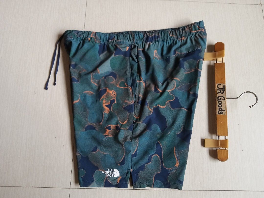 The North Face athletic Camo Shorts (Category: Shorts) located in Tanay. Submitted by jrgoods (Listing ID 1469959494, Image 1). Description: TNF athletics aop short Large men's above the knee Waistline 34-36 Length 17.5 Good as new condition 880+ship Tanay Rizal location Shipping Nationwide - Color/Pattern: Blue and green abstract camouflage - Features: Elastic drawstring waistband, side pockets, lightweight fabric - Branding: White TNF logo on l