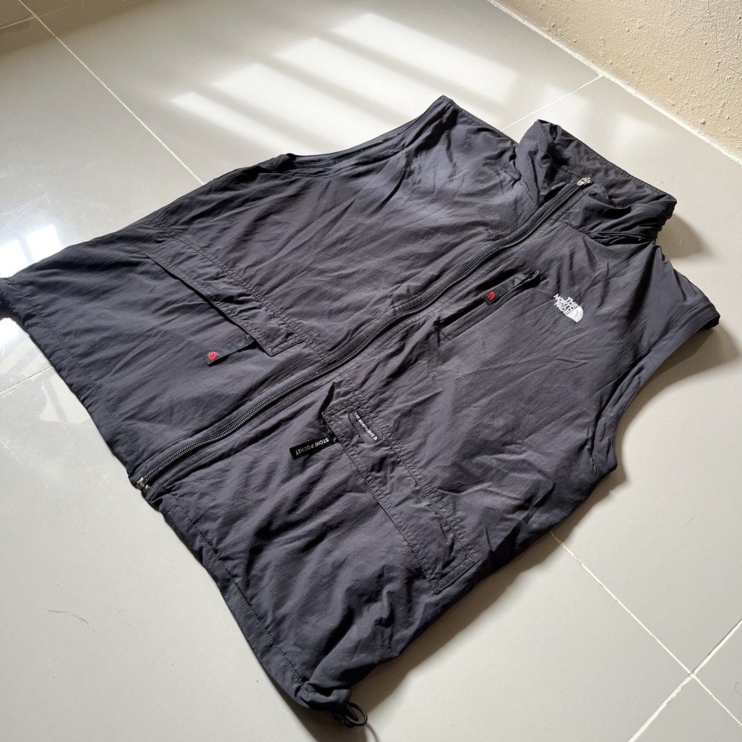 The North Face Black Vest Size 100 M (Category: Vests) located in Toledo. Submitted by collective_stuff (Listing ID 1469957995, Image 2). Description: - Brand: The North Face - Color: Dark Grey - Size: 100 (Fits like Medium) - Material: Durable nylon with breathable mesh inner lining - Closure: Full zip front - Pockets: Multiple front pockets plus a secure zippered chest pocket - Fit: Adjustable drawstring hem - Ideal for: Outdoor adventures, hik