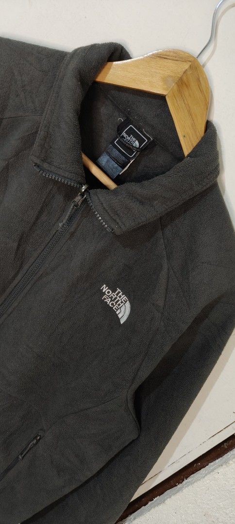 The North Face Dark Grey Fleece Jacket (Category: Coats, Jackets and Outerwear) located in Bulacan. Submitted by adrian2325 (Listing ID 1470111871, Image 3). Description: - Brand: The North Face - Color: Dark Grey - Material: Soft fleece (inside and out) - Fit: Regular - Features: Full zip closure, secure side pockets, high wind-blocking collar - Branding: Embroidered white logo on chest - Condition: Excellent outdoor piece for cold weather.