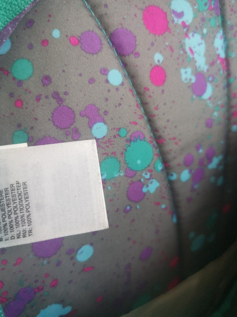 The North Face Homeslice Purple Backpack (Category: Backpacks) located in Quezon City. Submitted by trendsites.manila (Listing ID 1470108084, Image 3). Description: - Brand: The North Face (Homeslice backpack) - Condition: Brand new with original store tag attached - Color/Design: Purple with teal accents, grey mesh pockets, and a paint splatter pattern lining - Comfort features: Padded shoulder straps and adjustable chest buckle - Material: 100%