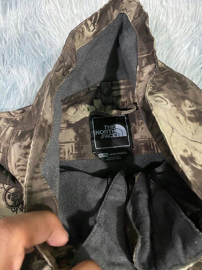 The North Face HyVent Men's Jacket XL (Category: Coats, Jackets and Outerwear) located in Manila. Submitted by gemfinds650 (Listing ID 1470101638, Image 3). Description: - Brand: The North Face - Size: Men's XL - Design: Unique brown & grey all-over camo print with white embroidered logos on chest and sleeve - Technology: HyVent waterproof fabric for ultimate weather protection - Features: Zip-up front with high collar for extra warmth - Conditio