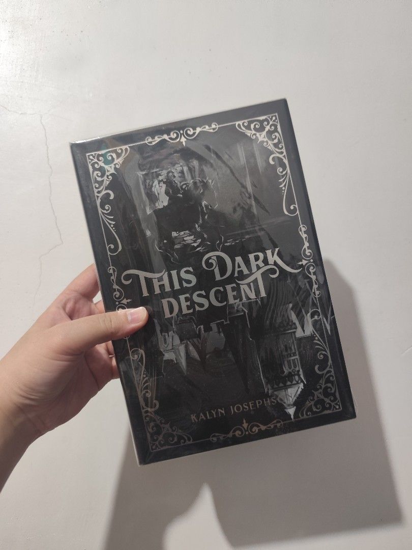 This Dark Descent by Kalyn Josephson Owlcrate Special Edition (Category: Storybooks) located in Bulacan. Submitted by mikkaryne (Listing ID 1470051349, Image 1). Description: - Title: This Dark Descent by Kalyn Josephson (Owlcrate Special Edition) - Format: Hardcover - Condition: Brand new - Special Features: Black sprayed edges and custom stenciled page edges featuring house crests - Perfect addition to any fantasy book collection!.