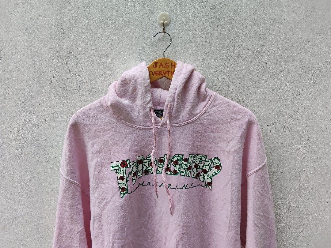 Thrasher Magazine Rose Vines Pink Hoodie Pull Over (Category: Hoodies) located in City of Isabela. Submitted by jasheverything (Listing ID 1469974155, Image 2). Description: - Brand: Thrasher Magazine - Color: Light Pink with Rose Vines chest graphic - Size: Large - Style: Classic skate hoodie with drawstring and front kangaroo pocket - Material: Soft and comfortable cotton blend - Condition: Very Good, well-maintained 1000+SF.