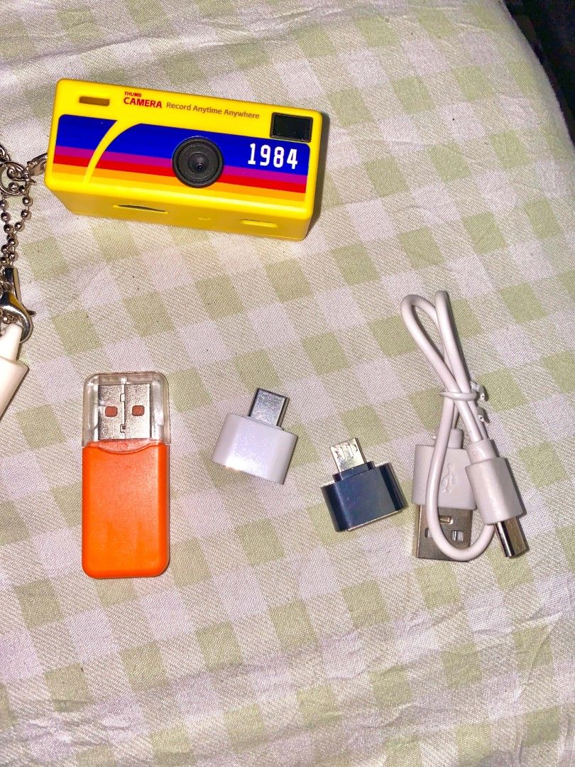 G6 Thumb Camera complete set 512gb (Category: Cameras) located in Manila. Submitted by gentle.lovexoxo_ (Listing ID 1470035838, Image 3). Description: -never been used outside (sa house lang) - Model: 1984 Thumb Camera in vibrant yellow with a fun rainbow design - Included Keychain: Features a cute small camera charm - Complete Set: Comes with original box, USB charging cable, USB card reader, and adapters - Storage: Includes a high-capacity 512G