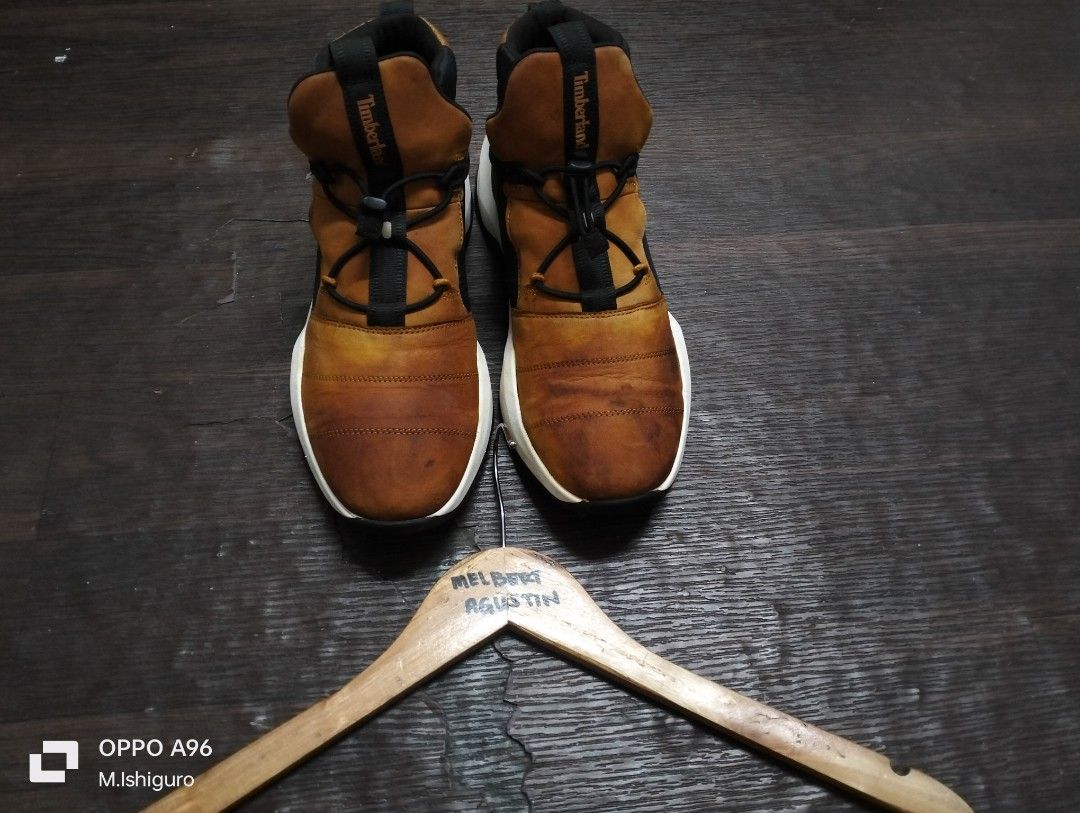 Timberland High-Top Sneakers Brown White (Category: Casual Shoes) located in Victoria. Submitted by fourem_clothingstore (Listing ID 1470002806, Image 2). Description: - Brand: Timberland - Style: High-top sneakers in wheat brown and black - Sole: Chunky white midsole with dark lugged rubber outsole for superior grip - Closure: Convenient toggle lace-up system - Branding: Iconic Timberland tree logo on the outer side - Comfort: Padded collar arou