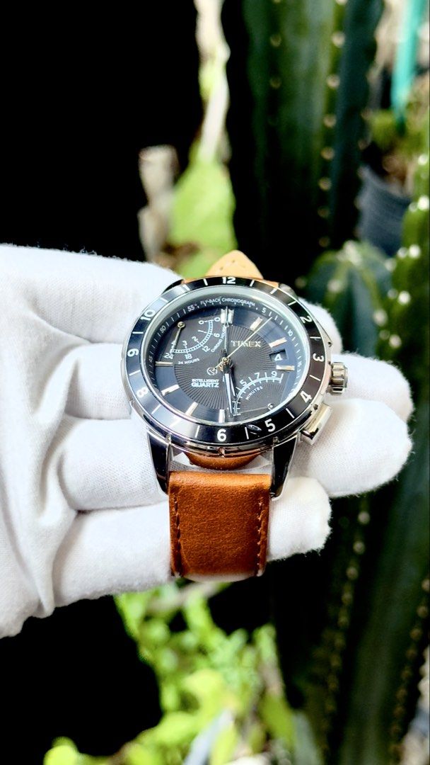 Timex Intelligent Quartz Fly-Back Chronograph Watch (Category: Men's Watches) located in Manila. Submitted by junjun12356 (Listing ID 1469997836, Image 2). Description: Timex Intelligent Quartz chronograph watch with a fly-back function. Dark textured dial, tachymeter bezel, stainless steel case. Rich tan leather strap with a polished buckle. Chronograph sub-dials at the top left and bottom right, date window on the right side. Indiglo night-ligh
