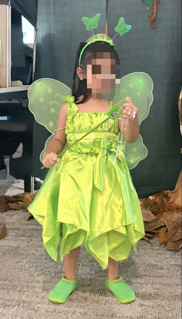 Tinker Bell Costume (Category: Babies & Kids Fashion) located in Pasig City. Submitted by abigaelde41187 (Listing ID 1470032385, Image 2). Description: Tinkerbell dress used once only during office trick or treat. Included is the headband, wing and wand. The dress is adjustable at the back. Can fit for 2-3 years old.