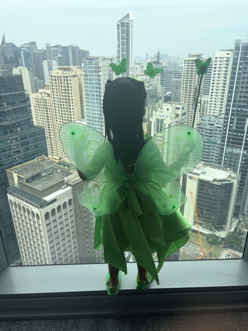 Tinker Bell Costume (Category: Babies & Kids Fashion) located in Pasig City. Submitted by abigaelde41187 (Listing ID 1470032385, Image 1). Description: Tinkerbell dress used once only during office trick or treat. Included is the headband, wing and wand. The dress is adjustable at the back. Can fit for 2-3 years old.