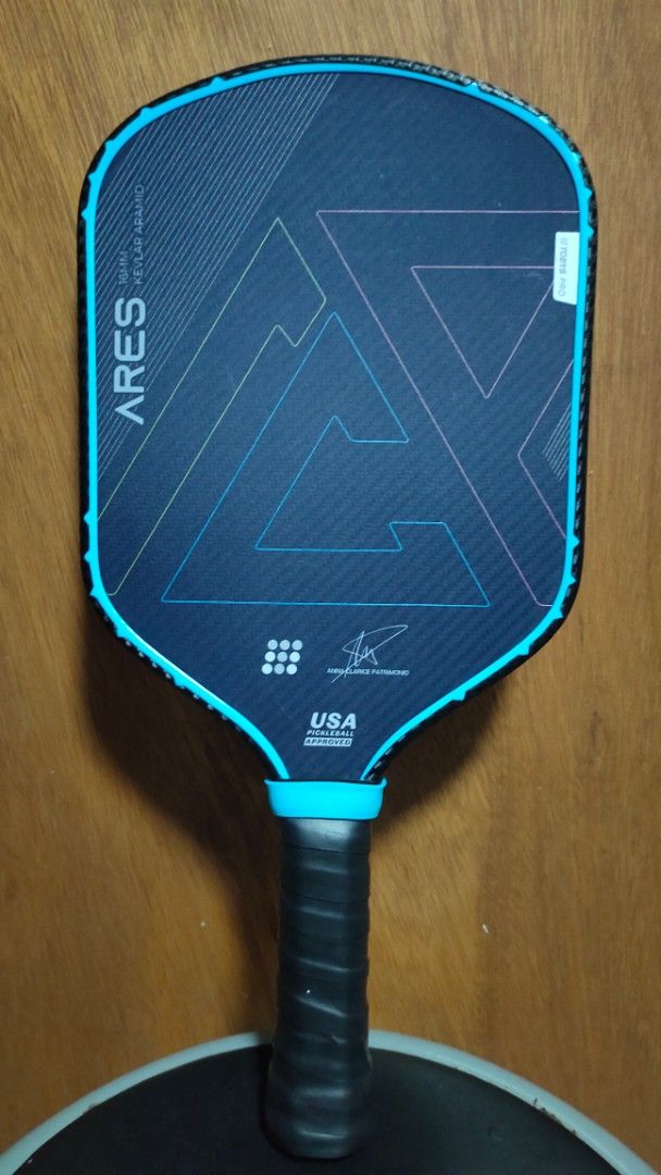 Tobys Pro Ares Pickleball Paddle (Category: Racket and Ball Sports) located in Malolos. Submitted by swiftwolf.b4d4a7 (Listing ID 1470047481, Image 1). Description: - Brand/Model: Tobys Pro Ares Pickleball Paddle - Thickness: 16mm for great touch and power - Material: Premium Kevlar aramid construction - Certification: USA Pickleball approved - Design: Blue and black colorway with sleek geometric triangle graphics - Handle: Wrapped with fresh bla