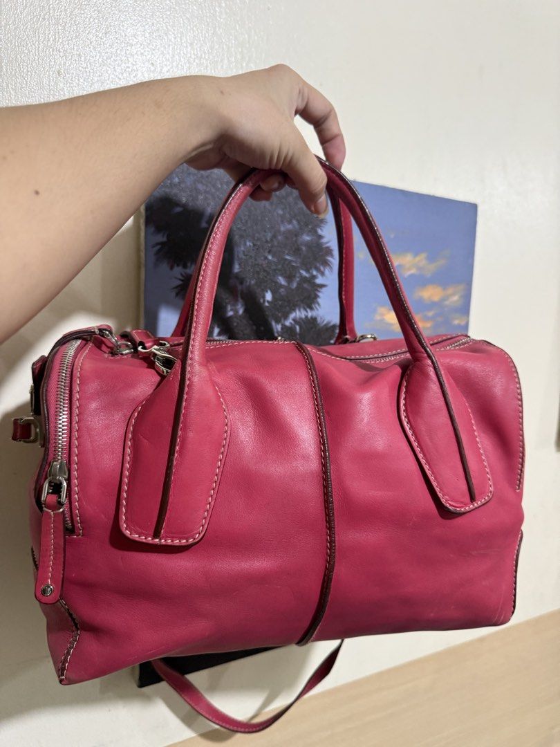 Tod's D-Styling Bauletto Piccolo (Category: Shoulder Bags) located in Quezon City. Submitted by vianca13 (Listing ID 1470035554, Image 1). Description: - Brand: Tod's - Material: Pink leather with silver-tone hardware - Style: Bowler bag with double top handles and a detachable shoulder strap - Closure: Top zip closure with branded side hardware detail - Interior: Spacious main compartment for your daily essentials - Structure: Firm, well-maintai