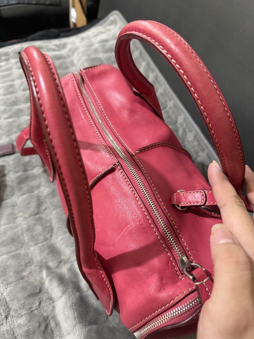 Tod's D-Styling Bauletto Piccolo (Category: Shoulder Bags) located in Quezon City. Submitted by vianca13 (Listing ID 1470035554, Image 2). Description: - Brand: Tod's - Material: Pink leather with silver-tone hardware - Style: Bowler bag with double top handles and a detachable shoulder strap - Closure: Top zip closure with branded side hardware detail - Interior: Spacious main compartment for your daily essentials - Structure: Firm, well-maintai