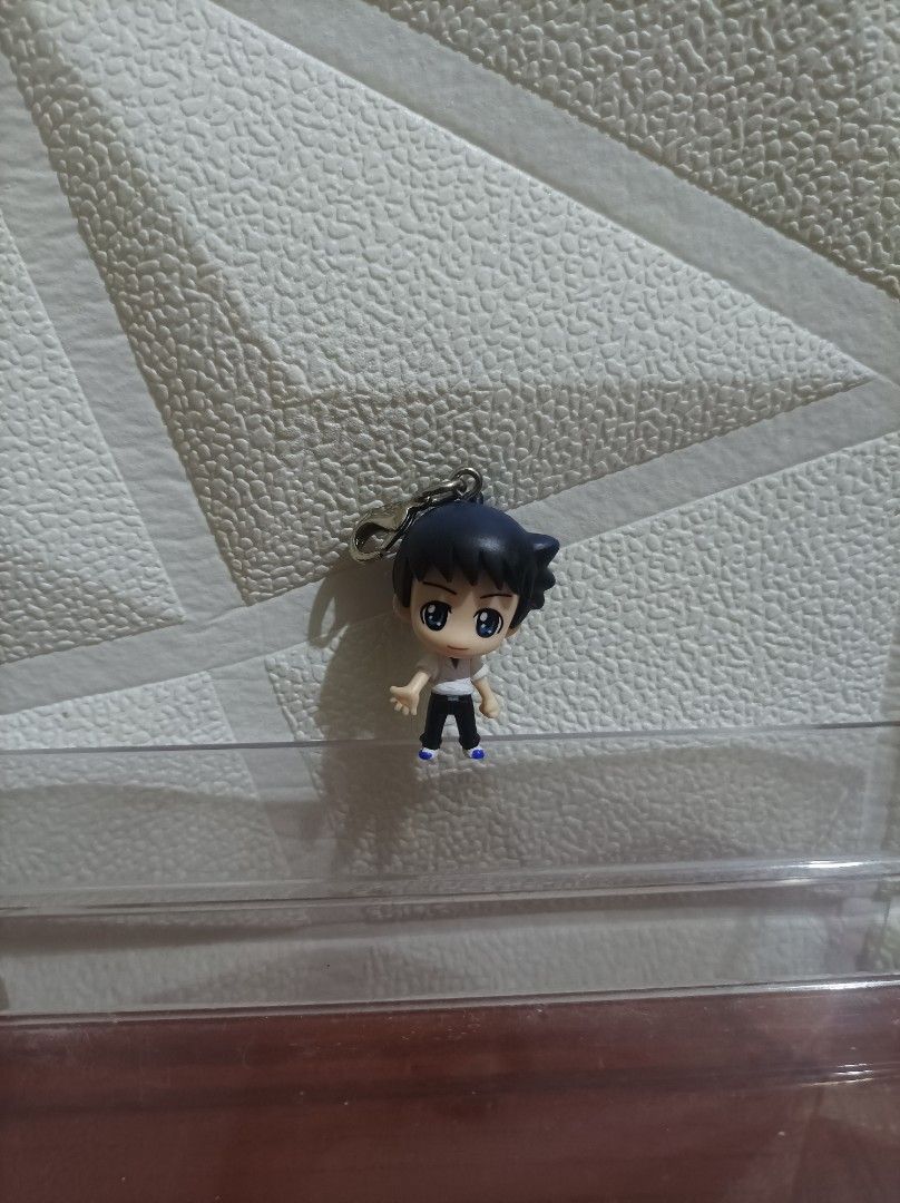 Evangelion Shinji (Category: Character Goods) located in Bacoor. Submitted by kuroochiii94695 (Listing ID 1469995705, Image 1). Description: - Item: Shinichi Kudo Chibi Figure Keychain - Anime: Detective Conan - Design: Dark hair, white button-down shirt, and black pants - Attachment: Sturdy metal clasp for keys, bags, or lanyards - Condition: Overall clean shape with possible minor paint scuffs from storage - Ideal for: Anime fans and collectors