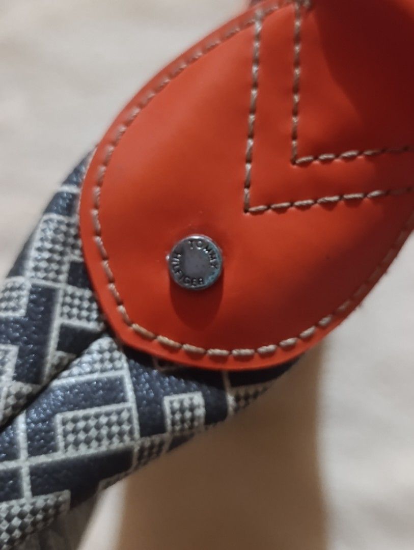Tommy Hilfiger Monogram Shoulder Bag Orange Black (Category: Shoulder Bags) located in Leyte. Submitted by itz_zy (Listing ID 1470099079, Image 2). Description: 👜 PRELOVED TOMMY HILFIGER BAG 🤎 ✨ Classic design | Vintage-inspired | Timeless style Selling this preloved Tommy Hilfiger-branded bag featuring a black-and-beige geometric pattern with reddish-brown accents. Its classic design makes it easy to pair with casual outfits, jeans, dresses, a