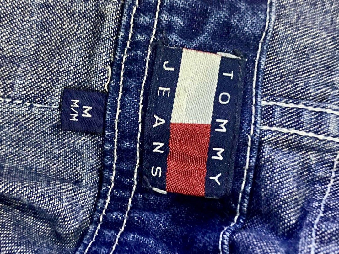 Tommy Jeans Denim Overalls Dungarees Medium (Category: Jumpsuits) located in Quezon City. Submitted by heybailey (Listing ID 1470093752, Image 3). Description: - Brand: Tommy Jeans - Item: Denim Overalls - Color: Dark Blue - Size: Medium (Tag attached) - Fit: Straight leg, great streetwear piece - Details: Branded elastic shoulder straps with metal hardware - Graphics: Embroidered HYS graphics on front legs and back pocket, iconic flag logo patch