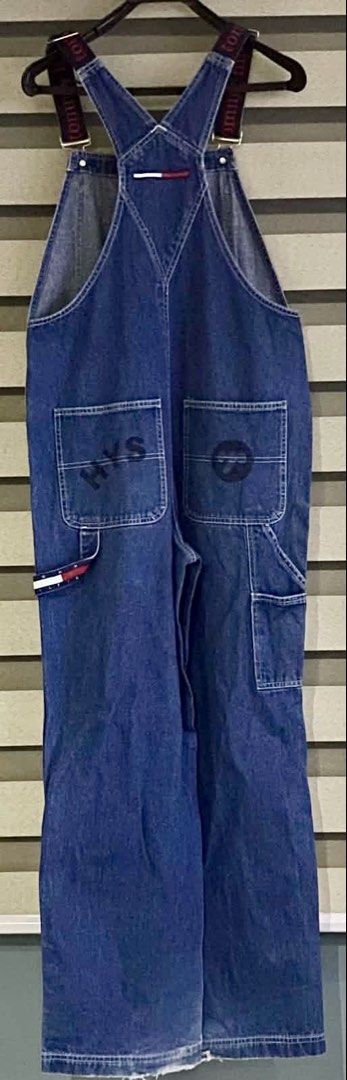 Tommy Jeans Denim Overalls Dungarees Medium (Category: Jumpsuits) located in Quezon City. Submitted by heybailey (Listing ID 1470093752, Image 2). Description: - Brand: Tommy Jeans - Item: Denim Overalls - Color: Dark Blue - Size: Medium (Tag attached) - Fit: Straight leg, great streetwear piece - Details: Branded elastic shoulder straps with metal hardware - Graphics: Embroidered HYS graphics on front legs and back pocket, iconic flag logo patch