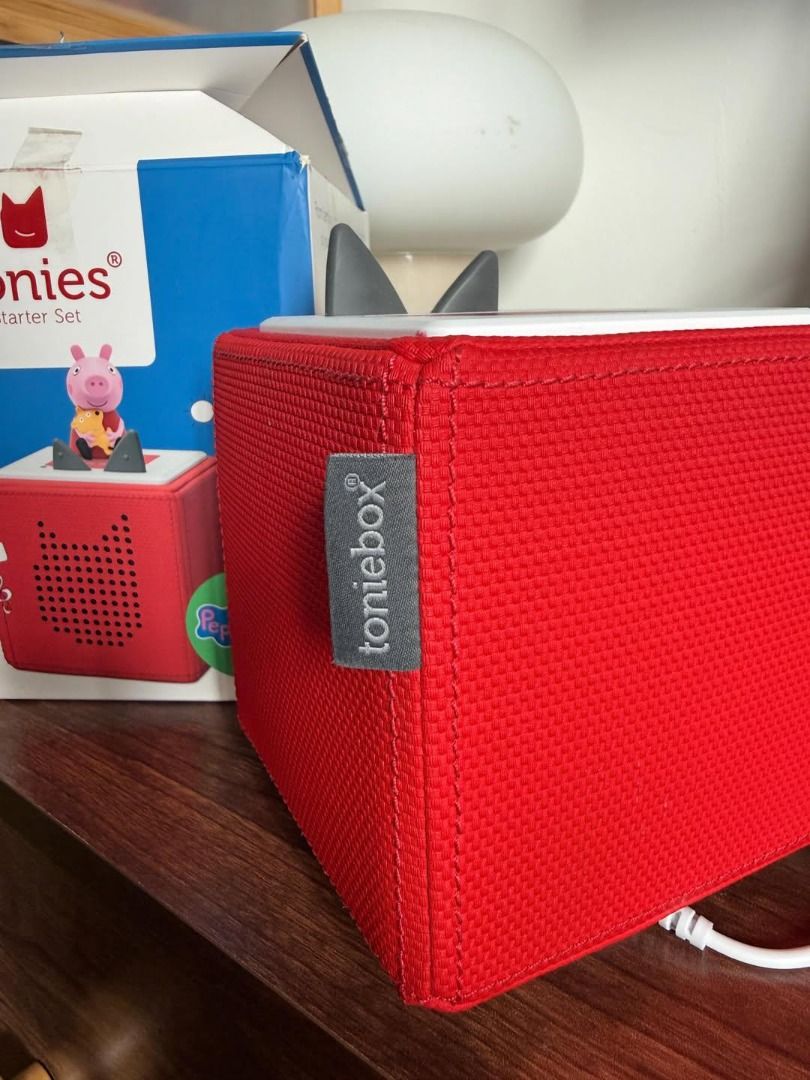 Toniebox Starter Set Red (Category: Portable Music Players) located in Caloocan City. Submitted by safeocean_2aa2ec (Listing ID 1469989001, Image 3). Description: - Color: Red - Condition: Fully functional, comes with original box and charging station - Kid-friendly design: Soft fabric exterior, sturdy build, and simple ear controls on top - Features: Great screen-free entertainment for storytelling and music - Ready to use: Just plug in the char