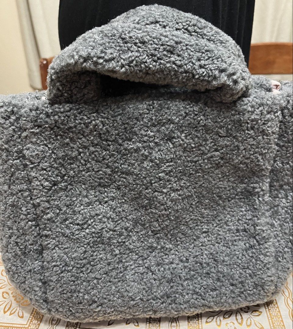 Top handle bag (Category: Tote Bags) located in Bacoor. Submitted by ayit. (Listing ID 1470060179, Image 2). Description: Orig once used japan gling - Color: Gray with pink embroidery - Material: Soft plush fleece / faux shearling - Features: 'ALLISON BROWN' text and cute heart embroidery on the front - Interior: Light pink lining with convenient slip pockets - Closure: Secure button snap - Style: Chic top handle tote bag, perfect for casual outi
