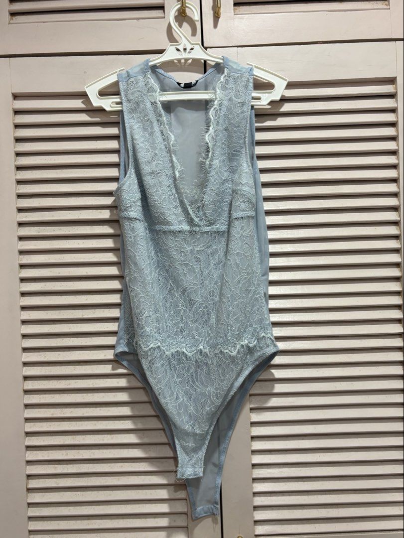 Topshop Light Blue Lace Bodysuit (Category: Sleeveless) located in Muntinlupa City. Submitted by sukimum (Listing ID 1469985412, Image 1). Description: Worn thrice (with underwear on) No issues on the lace panels, fabric is still gorgeous. Great for nights out.