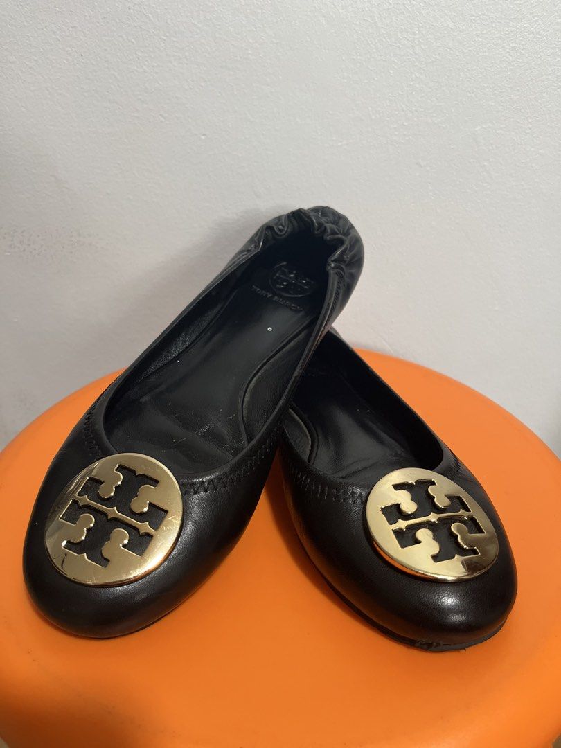 Tory Burch Black Leather Logo Ballet Flats (Category: Flats & Sandals) located in Valenzuela. Submitted by sofiasticated.decluttering (Listing ID 1470000939, Image 1). Description: - Brand: Tory Burch - Color: Classic Black - Material: Genuine Leather - Details: Gold-tone logo plaque on toe, elasticized topline for a comfortable slip-on fit - Condition: Pre-loved with visible wear on leather/soles and a minor scuff near the front edge (please che