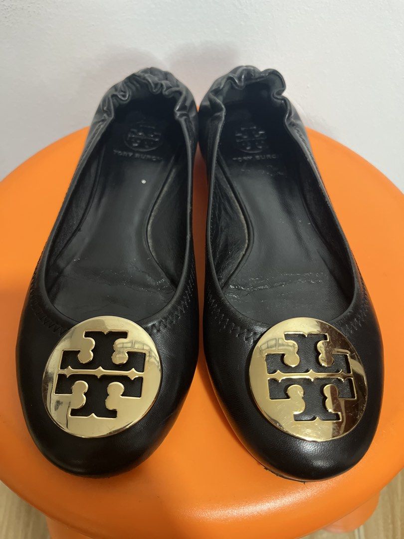 Tory Burch Black Leather Logo Ballet Flats (Category: Flats & Sandals) located in Valenzuela. Submitted by sofiasticated.decluttering (Listing ID 1470000939, Image 2). Description: - Brand: Tory Burch - Color: Classic Black - Material: Genuine Leather - Details: Gold-tone logo plaque on toe, elasticized topline for a comfortable slip-on fit - Condition: Pre-loved with visible wear on leather/soles and a minor scuff near the front edge (please che