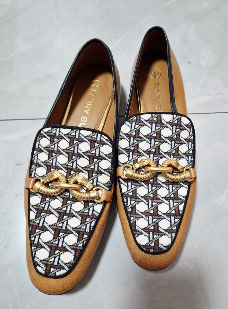 Tory Burch Jessa Loafers Size 9M (Category: Loafers) located in Caloocan City. Submitted by imladris1016 (Listing ID 1469983051, Image 2). Description: - Brand: Tory Burch - Style: Classic slip-on loafers - Color/Material: Brown and patterned fabric, Leather Upper and Sole - Hardware: Gold-tone detail across the front - Size: 9M - Condition: Good pre-loved condition; leather soles show minimal wear from previous use - Perfect for office wear, cas