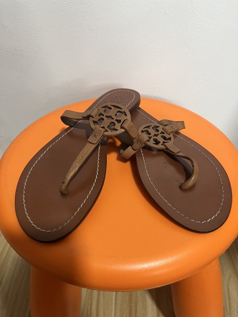 Tory Burch Miller Leather Sandals Tan (Category: Flats & Sandals) located in Valenzuela. Submitted by sofiasticated.decluttering (Listing ID 1470001401, Image 1). Description: - Brand: Tory Burch - Style: Miller Thong Sandals - Color: Tan leather with white contrast stitching - Details: Iconic cutout double T logo, stamped heel logo, flat heel style ✅ SIZE: EU 38 23.5 -24cm US7 ✅PRE- OWNED and NOT suitable for picky buyers, ✅EXCELLENT CONDITION ‼