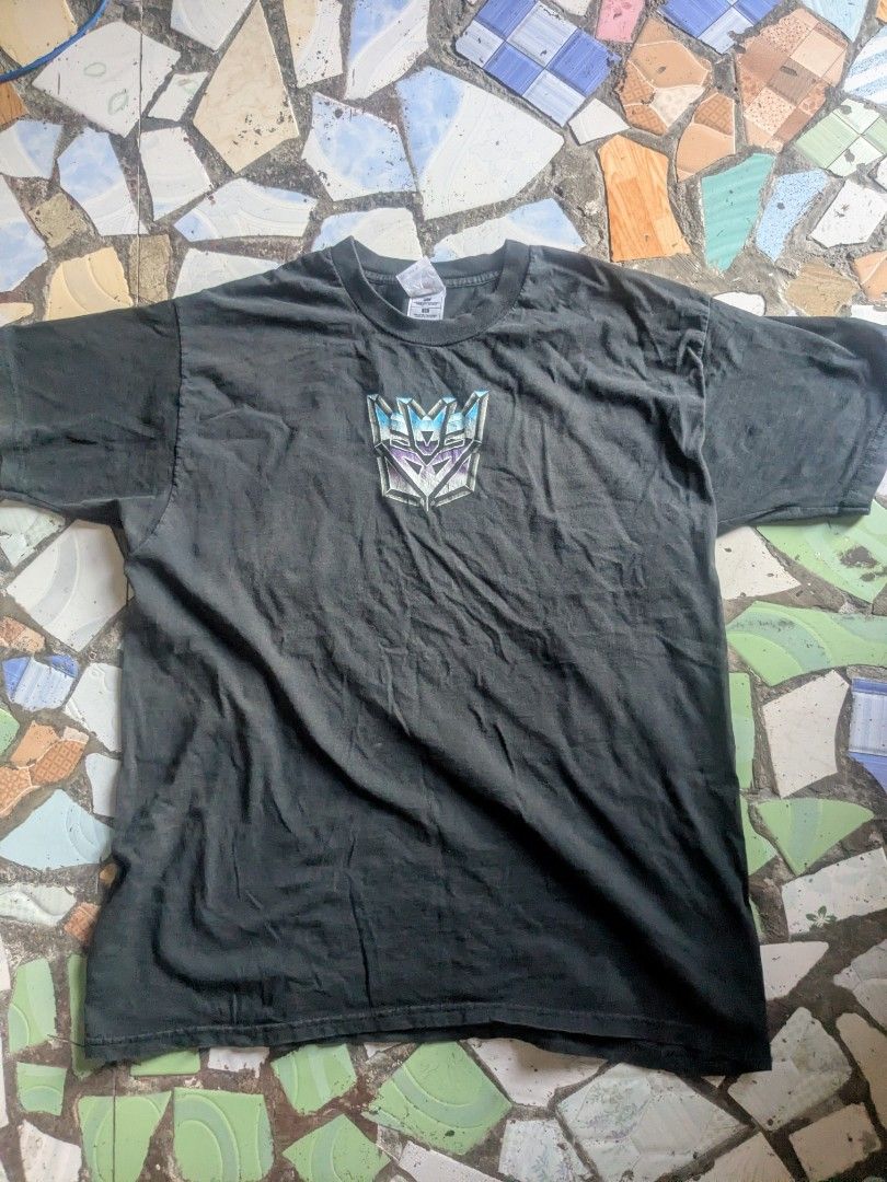 transformers deception vintage 90's tshirt xl (Category: Tshirts & Polo Shirts ) located in Manila. Submitted by ltdshop808 (Listing ID 1470046313, Image 1). Description: transformers deception vintage 90's tshirt xl made in El Salvador fotl tag used good condition black color thick fabric cotton wyswyg silkscreen print came from USA unisex price p2899 payment via gcash free shipping.