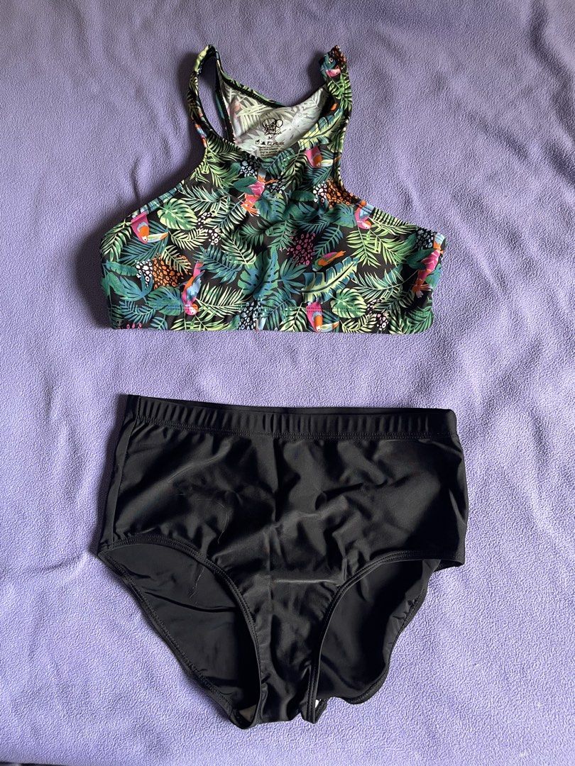 Tropical Leaf Print High Neck Bikini Set Size M (Category: Bikinis & Swimsuits) located in Antipolo. Submitted by chicgrc (Listing ID 1469967948, Image 1). Description: - Size: M - Style: Two-piece swimsuit with high-neck, racerback top and high-waisted bottoms - Design: Tropical leaf and bird pattern top, solid black full-coverage bottoms - Material: Stretchy, comfortable swim fabric - Condition: Clean inside and out, ready to wear.