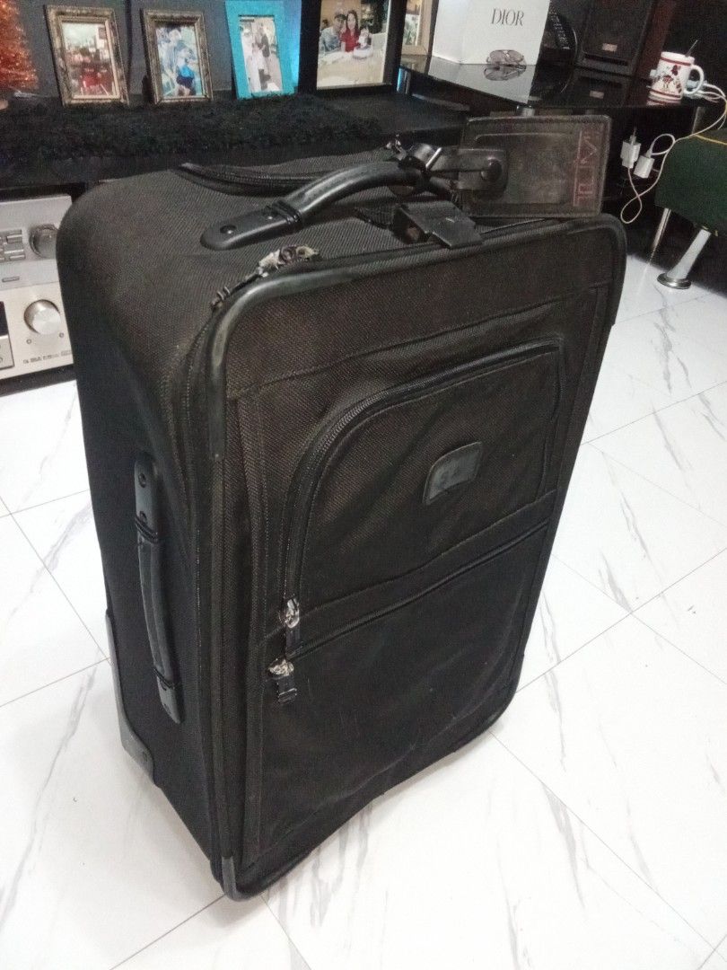 Tumi Luggage Roller Bag Original (Category: Luxury Bags & Wallets) located in Manila. Submitted by christoph17 (Listing ID 1470055561, Image 1). Description: great condition original issue on last pic broken handle.