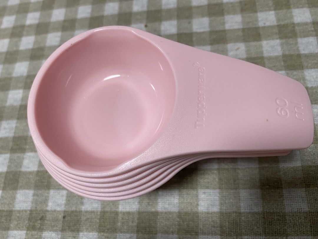 Tupperware Pink Measuring Cups Set of 6 (Category: Coffee & Tea Tableware) located in Cavite. Submitted by yc.shoppemnl (Listing ID 1469998198, Image 2). Description: - Authentic Tupperware pink measuring cups set - Includes 6 handy sizes: 60ml, 80ml, 120ml, 160ml, 180ml, and 240ml - Made with durable, high-quality plastic - Stackable design for easy and neat storage - Clean, sanitized, and ready to use.