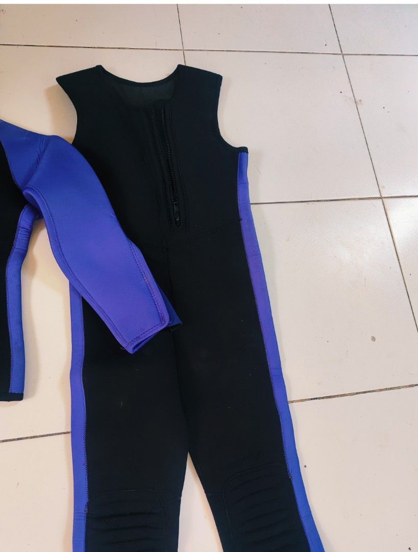 Two-piece black and blue scuba diving wetsuit set (Category: Rash guard) located in Bulacan. Submitted by babz30261 (Listing ID 1470071761, Image 2). Description: - Type: Two-piece scuba diving wetsuit - Color: Black and blue - Material: High-quality neoprene for optimal warmth and flexibility - Jacket: Long sleeves, front zipper, and zippered cuffs for easy wear - Jumpsuit: Sleeveless, long-leg design with front zipper - Protection: Built-in kne