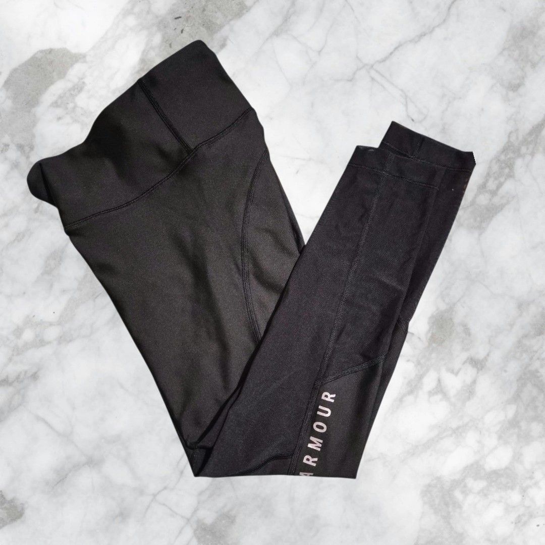 Under Armour Black Mesh Leggings Crop (Category: Activewear) located in Paranaque City. Submitted by calm_youngstore7 (Listing ID 1469967456, Image 2). Description: LOWEST PRICE GUARANTEED! Under Armour HeatGear leggings in black. Size M. High-waisted style with mesh panels down the lower legs for extra breathability. Brand logo printed vertically along the left leg in white. Original tags still attached, never worn. Great for workouts, running, 