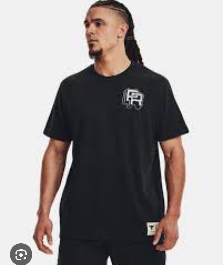Under Armour Project Rock Training Camp T-Shirt (Category: Activewear) located in San Jose del Monte. Submitted by azetor (Listing ID 1469970810, Image 2). Description: - Brand: Under Armour Project Rock - Color: Dark Navy Blue - Size: Medium (M) - Design: Large back graphic with 'Hardest workers in the room' and 'It all starts in the iron paradise' quotes - Details: Small PR logo on front chest and bottom hem tag - Material: Comfortable cotton b