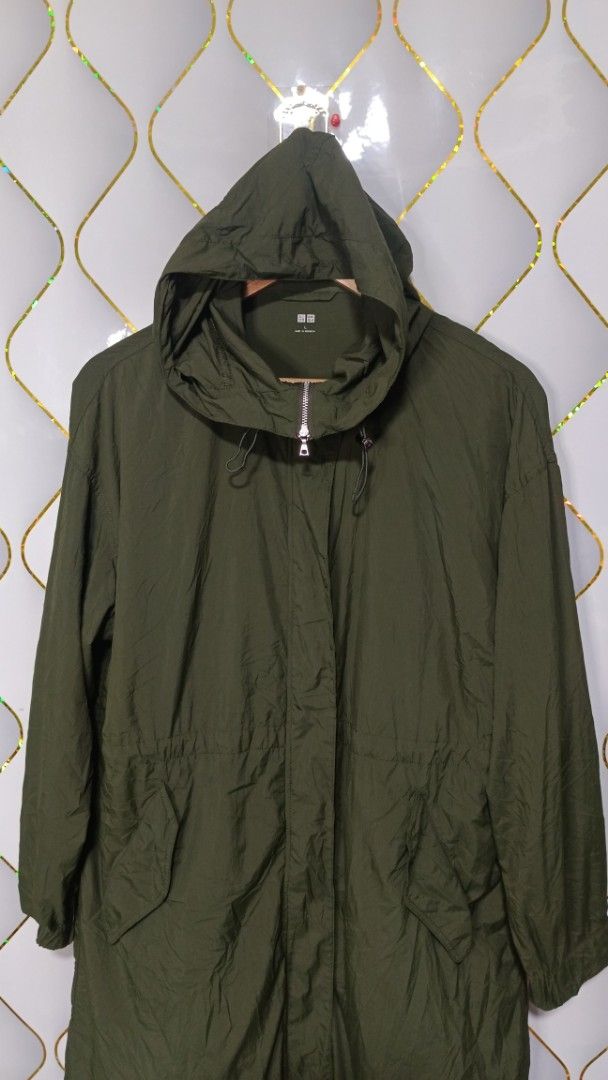 Uniqlo Olive Green Parka Jacket (Category: Coats, Jackets and Outerwear) located in Manila. Submitted by zariyah.1986 (Listing ID 1469963825, Image 2). Description: - Brand/Model: Uniqlo Jacket - Color: Olive Green - Size: L - Closure: Full zip front with button flap cover - Hood: Attached hood with adjustable drawstring cords - Pockets: Two front pockets with secure snap buttons - Fit: Internal drawstring waist for a flattering, adjustable fit -
