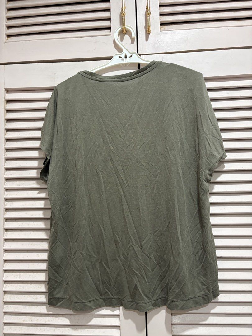 Uniqlo Olive Green Top (Category: Shirts) located in Muntinlupa City. Submitted by sukimum (Listing ID 1469988273, Image 2). Description: The material is from their earlier cotton jersey line.