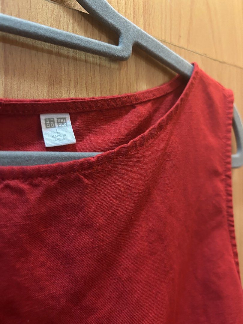 Uniqlo Red Sleeveless Top Size L (Category: Sleeveless) located in Quezon City. Submitted by francineznsantos (Listing ID 1470047396, Image 2). Description: - Brand/Model: Uniqlo sleeveless top - Color: Bright red - Size: L - Design: Scoop neckline with back button closure - Material: Lightweight fabric - Perfect for everyday casual wear in warm weather.