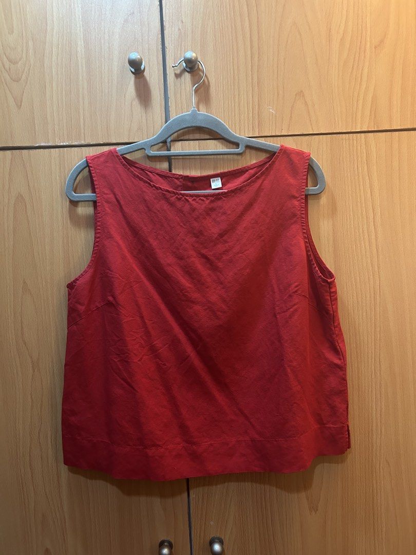 Uniqlo Red Sleeveless Top Size L (Category: Sleeveless) located in Quezon City. Submitted by francineznsantos (Listing ID 1470047396, Image 1). Description: - Brand/Model: Uniqlo sleeveless top - Color: Bright red - Size: L - Design: Scoop neckline with back button closure - Material: Lightweight fabric - Perfect for everyday casual wear in warm weather.