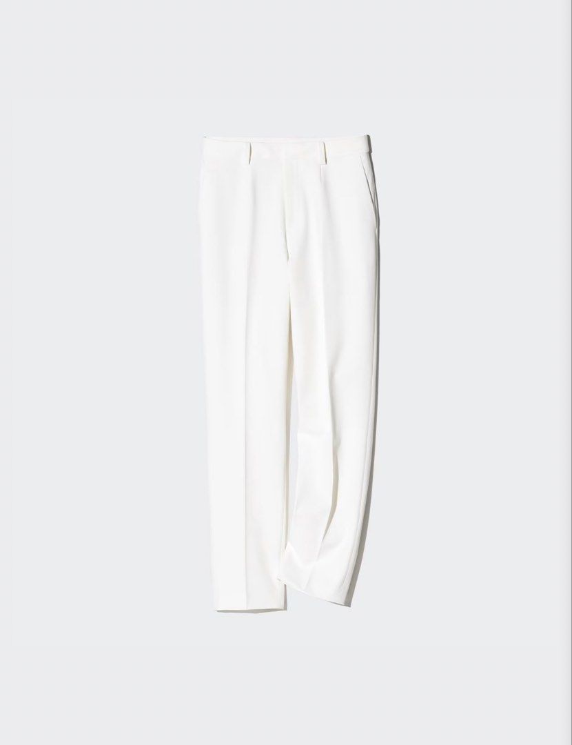 Uniqlo Smart Ankle Pants White Trouser (Category: Other Bottoms) located in Dasmarinas. Submitted by aoe.ae (Listing ID 1470095393, Image 1). Description: - Color: Clean white - Cut: Straight leg with center creases - Features: Waistband with belt loops, clean front closure, and deep side pockets - Fabric: Crisp with a smooth finish - Style: Versatile for office wear or formal events.