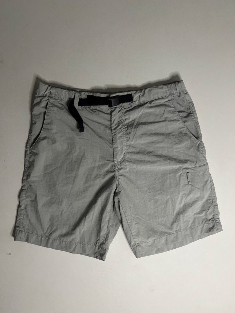 Uniqlo Utility ShortsGrey Size L (Category: Shorts) located in Tacloban City. Submitted by thrftg (Listing ID 1470086647, Image 1). Description: - Brand: Uniqlo - Color: Grey - Size: L (fits waist 84-92cm) - Material: Nylon and polyester blend - Features: Built-in adjustable belt with buckle, elastic waistband, and zipper fly - Pockets: Side pockets, secure zippered left leg pocket, and back welt pockets - Origin: Made in Indonesia - Condition: E