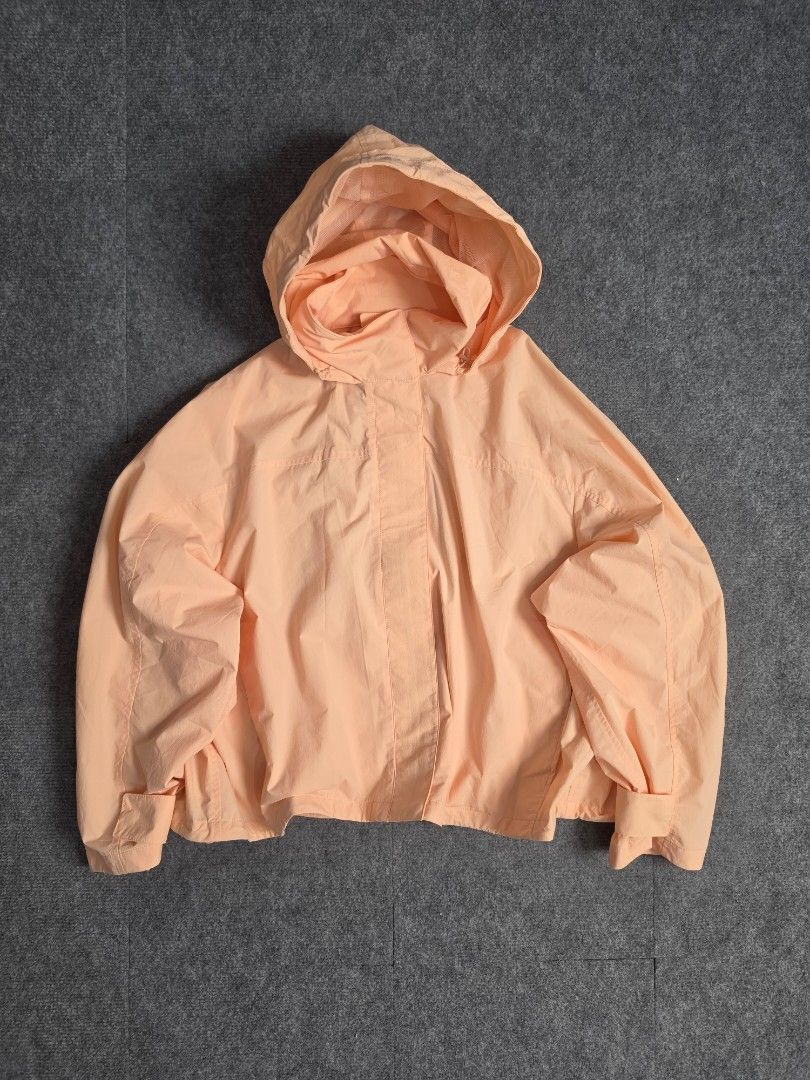 Uniqlo Windproof Stand Blouson (Category: Coats, Jackets and Outerwear) located in Baguio. Submitted by labelleferroniere (Listing ID 1470075340, Image 1). Description: Windproof Stand Blouson Peach (XL) (WMNS) Good as New Condition Dimensions (Photos) — Pocketable Hood — Adjustable Width ( with string ).