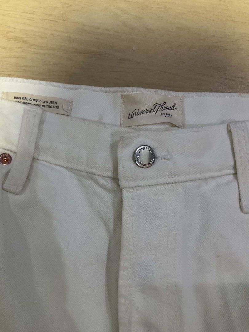 Universal Thread High Rise Curved Leg Jean White Size 14 (Category: Jeans) located in Manila. Submitted by thrifty111 (Listing ID 1470091270, Image 3). Description: - Brand: Universal Thread - Style: High rise curved leg / balloon silhouette with raw cropped hem - Color: White - Size: 14 Regular - Fit: Relaxed through the hip - Details: Classic five-pocket styling, copper tone rivets, front button closure - Condition: Brand new with tags (BNWT) s