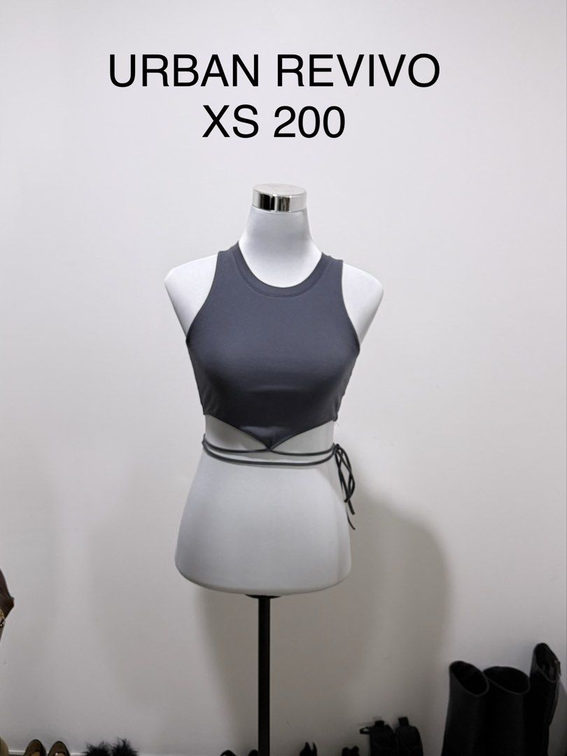 PRE LOVED BRANDED CLOTHES (Category: Sleeveless) located in Manila. Submitted by janalulu (Listing ID 1469970019, Image 1). Description: - Brand: Urban Revivo - Size: XS - Color: Solid grey - Style: Sleeveless crop top with unique waist-wrap strap details - Condition: Great, clean, and ready to wear - Additional Info: Measurements available upon request, quick shipping!.