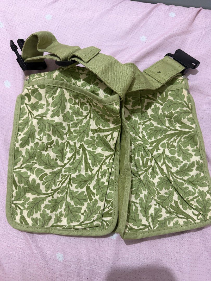 V&A by Ulster Weavers Green Leaf Pattern Tool Belt (Category: Belt bags, Clutches and Pouches) located in Manila. Submitted by maambeeeeyah (Listing ID 1469981794, Image 1). Description: - Brand: Ulster Weavers x V&A Museum - Design: Green botanical leaf and acorn print - Material: 100% durable cotton canvas with wipe-clean finish - Storage: Multiple front pockets and compartments - Fit: Adjustable strap with secure black plastic buckle closure.