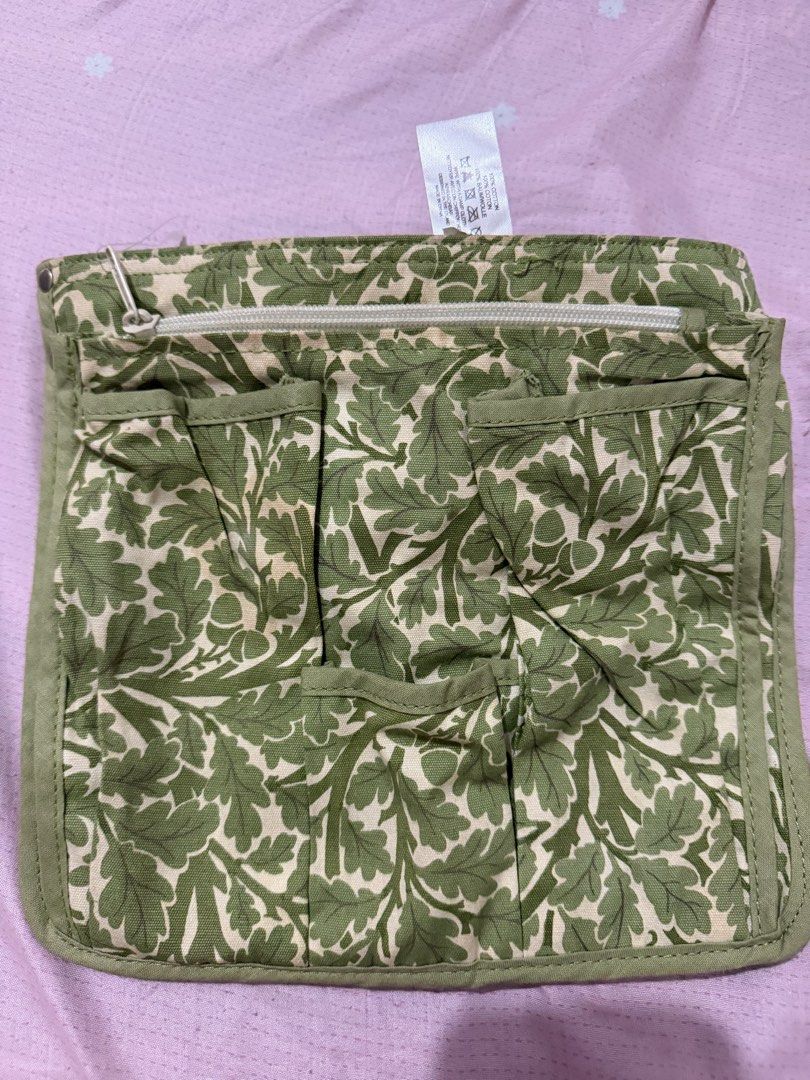 V&A by Ulster Weavers Green Leaf Pattern Tool Belt (Category: Belt bags, Clutches and Pouches) located in Manila. Submitted by maambeeeeyah (Listing ID 1469981794, Image 2). Description: - Brand: Ulster Weavers x V&A Museum - Design: Green botanical leaf and acorn print - Material: 100% durable cotton canvas with wipe-clean finish - Storage: Multiple front pockets and compartments - Fit: Adjustable strap with secure black plastic buckle closure.