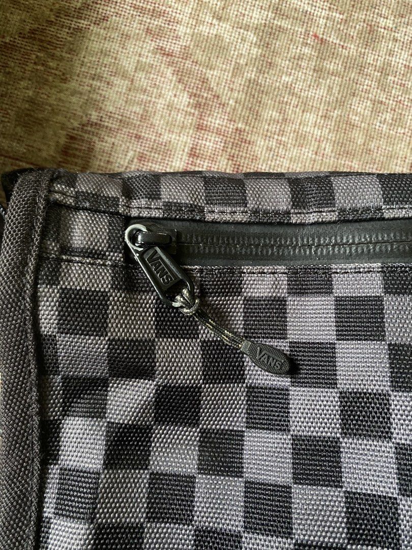 Vans Black and Grey Checkerboard Messenger Bag (Category: Sling Bags) located in Manila. Submitted by diporosmoh43681 (Listing ID 1469975947, Image 3). Description: Vans messenger bag with black and grey checkerboard pattern on the flap. Durable black fabric construction, buckle closure, adjustable shoulder strap with padded section. Zippered pocket on the front flap. Inside features checkered lining, zip pocket, and laptop compartment with velcr