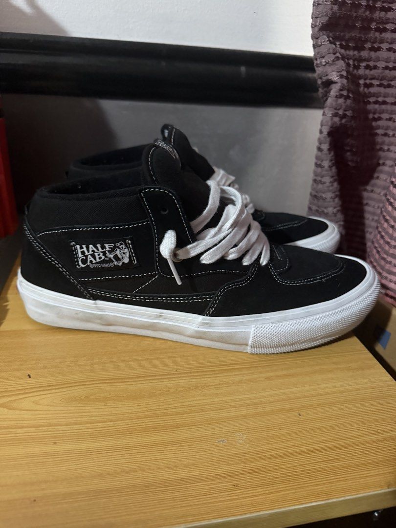 Vans Skate Half Cab (Category: Sneakers) located in Quezon City. Submitted by djrakrakantodamax (Listing ID 1469965383, Image 1). Description: - Brand: Vans Skate Half Cab - Color: Black and White - Style: Mid-top with signature side patch and heel checkerboard tag - Condition: Great pre-loved condition with minimal wear on the rubber waffle outsoles - Includes: Clean white laces - Durability: Solid skate shoes with plenty of life left.