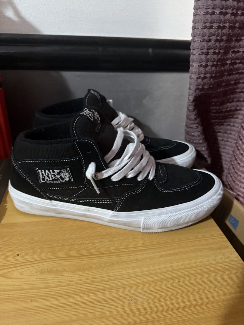 Vans Skate Half Cab (Category: Sneakers) located in Quezon City. Submitted by djrakrakantodamax (Listing ID 1469965383, Image 2). Description: - Brand: Vans Skate Half Cab - Color: Black and White - Style: Mid-top with signature side patch and heel checkerboard tag - Condition: Great pre-loved condition with minimal wear on the rubber waffle outsoles - Includes: Clean white laces - Durability: Solid skate shoes with plenty of life left.